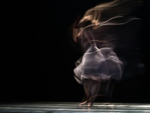 dancing woman on concrete pavement