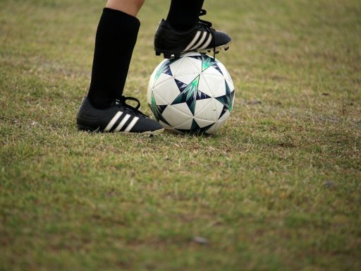 person playing soccer on field